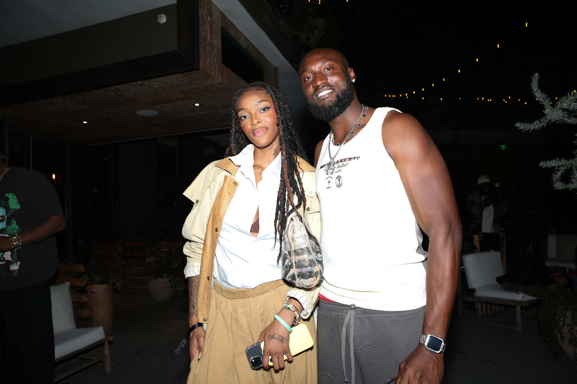 Two guests posing together on the Rhythm Garden patio