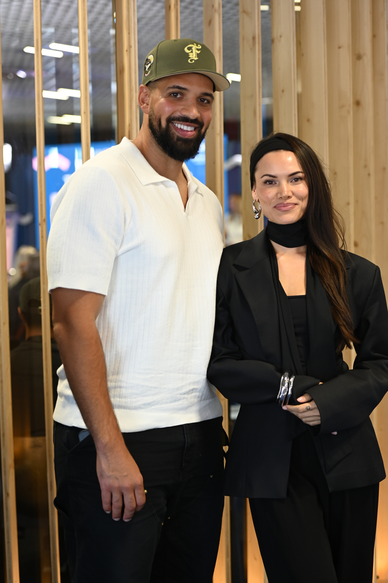 Tyler Sabino and a guest inside the Marché du Film pavilion at the Palais des Festivals