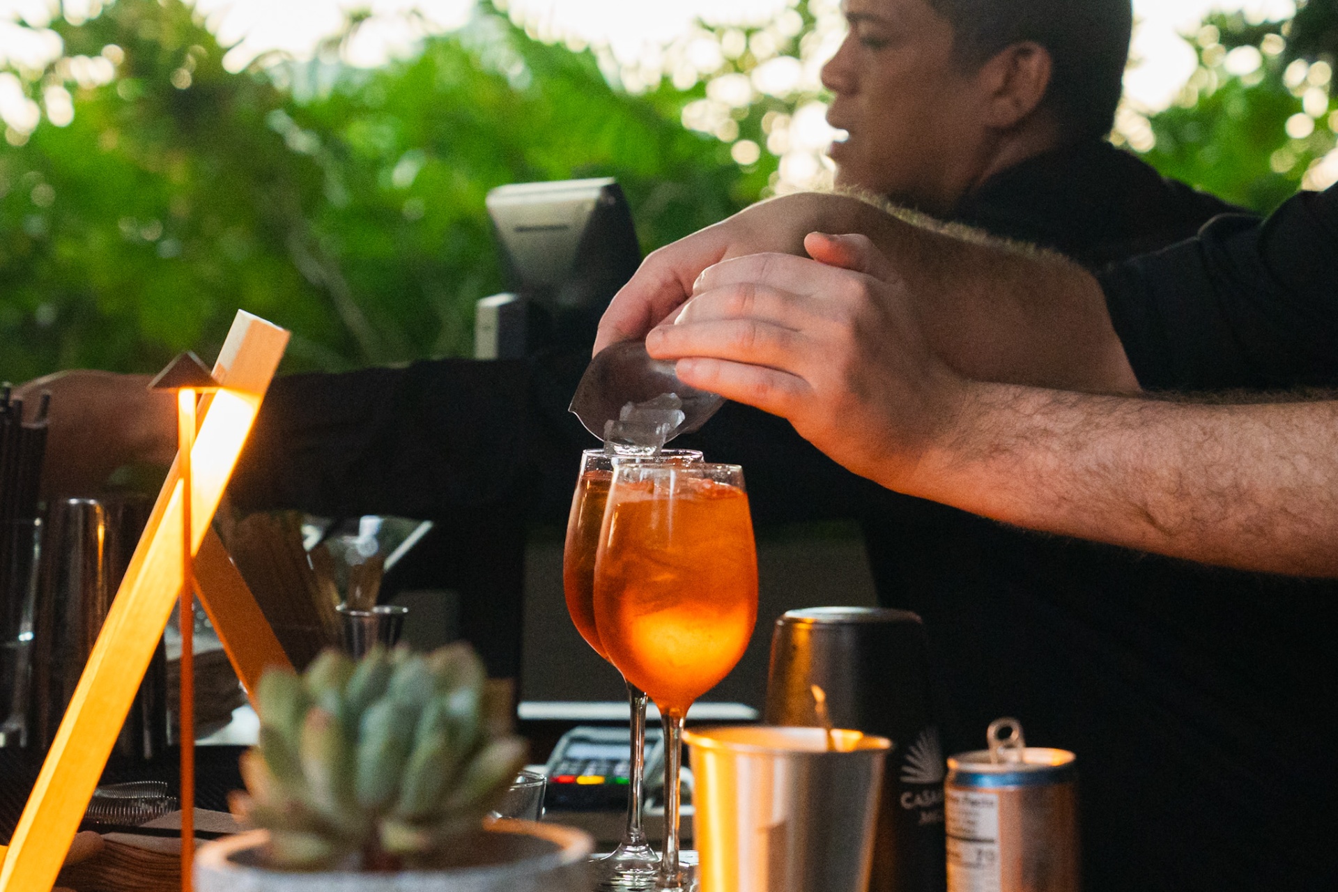 Bartenders serving cocktails at the Rhythm Garden activation